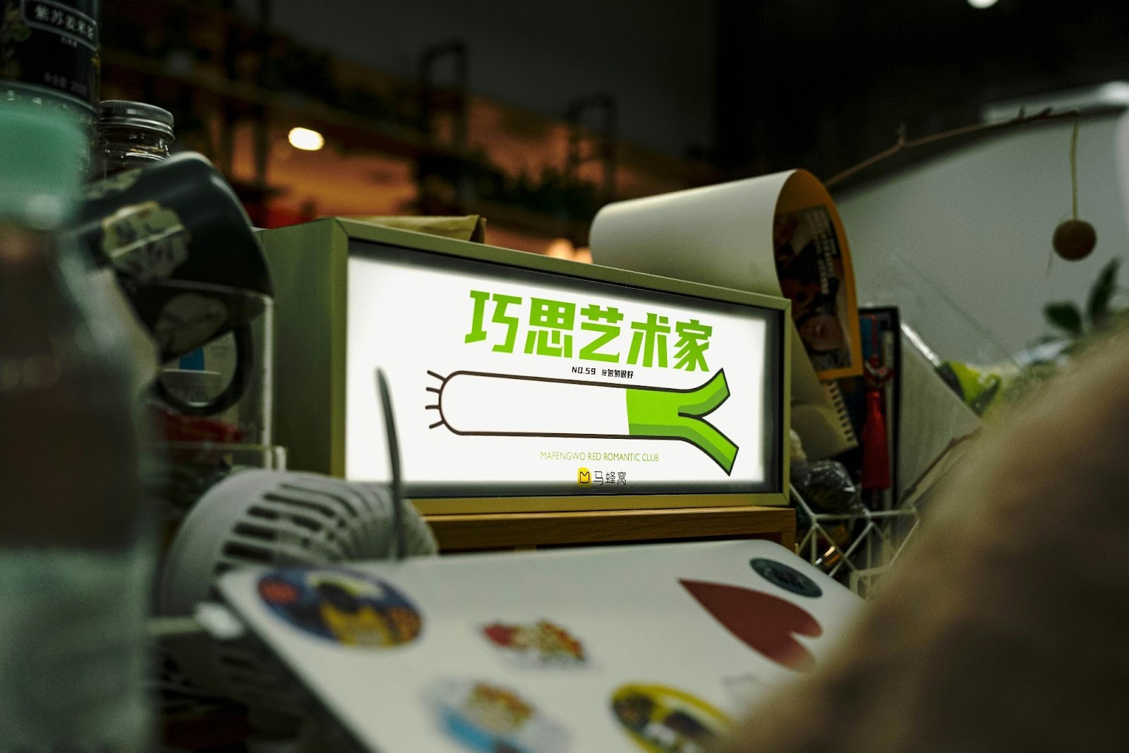 Illuminated lightbox sign with unique graphics, symbolizing creative branding strategies that help small businesses stand out in niche markets.
