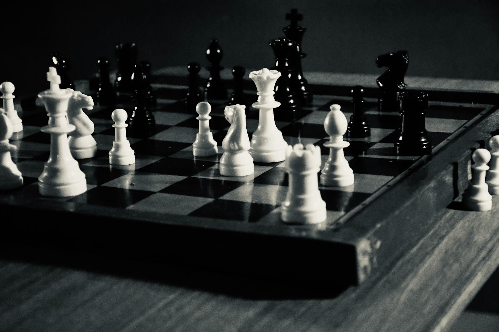 Chess pieces on a board representing the strategic planning required for a successful small business marketing campaign.