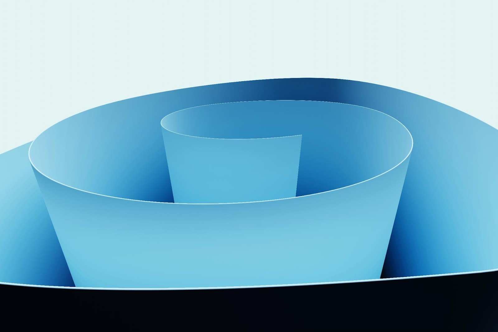 Abstract blue paper swirl design, representing the modern, clean aesthetic often used in dental practice branding and web design.