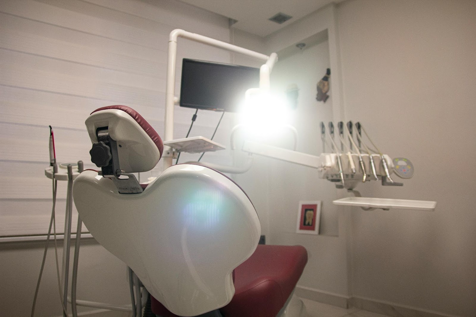 Modern dental chair with bright operating light, symbolizing the state-of-the-art facilities featured in dental video marketing tours.